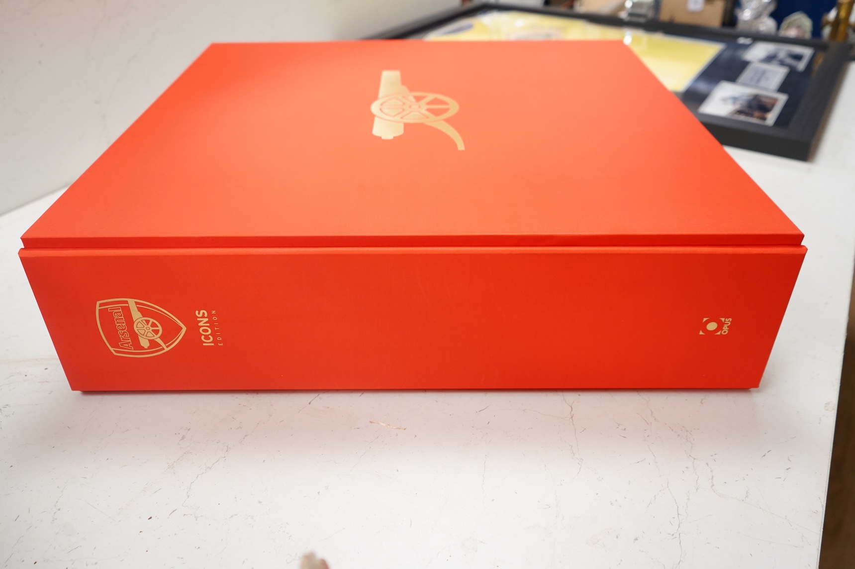 An Arsenal Opus, Icons Edition #47 in a series of 500, signed by Arsene Wenger, Tony Adams, Patrick Vieira, Dennis Bergkamp, Charlie George, Bob Wilson, Frank Mclintock, Thierry Henry, George Graham, Liam Brady, David Se